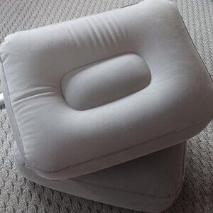 Two Grey Felt-Covered Inflatable Pillows
